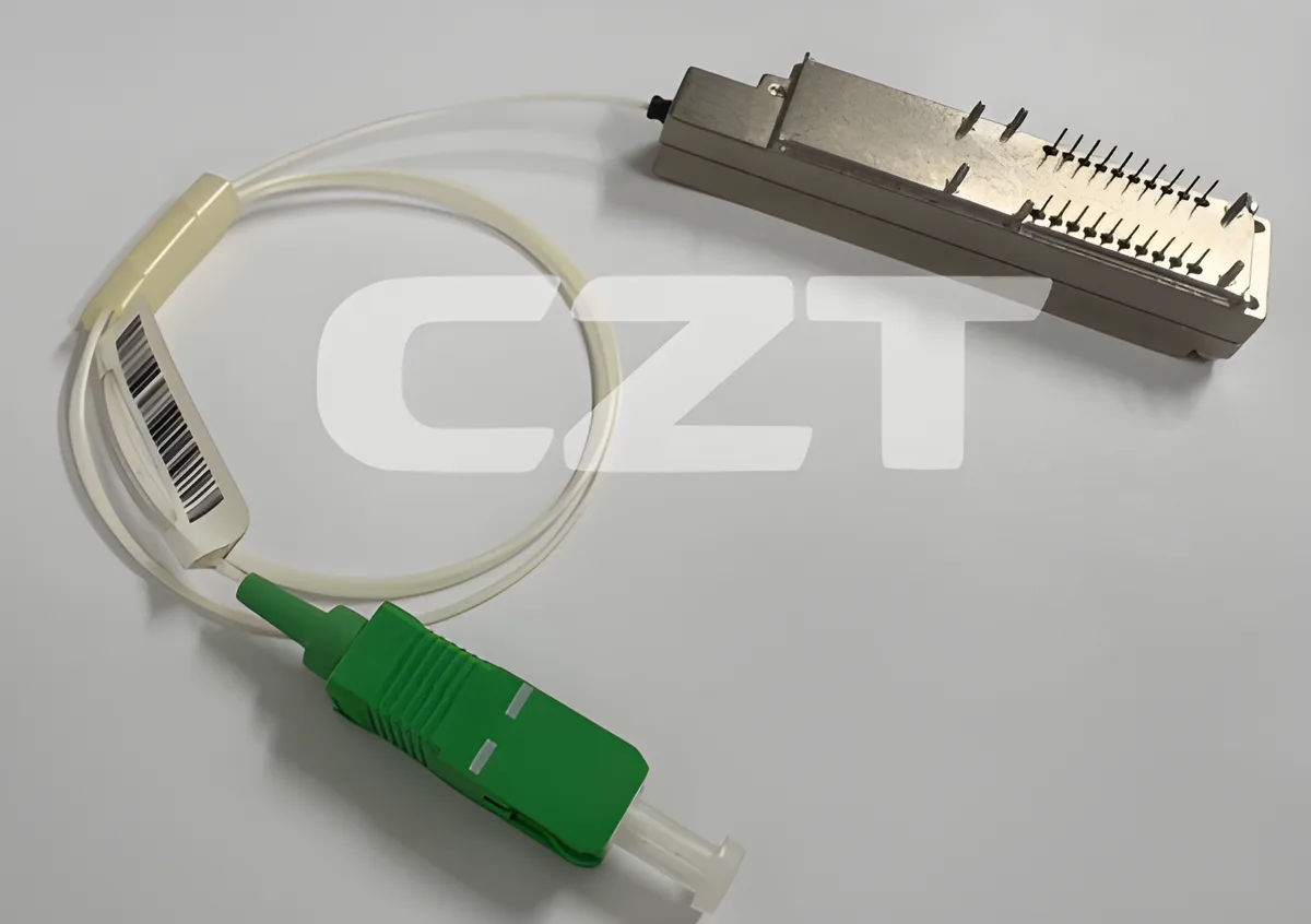 Electrical pigtail wire connector with green grounding wire and ring terminal attached to an outlet grounding screw